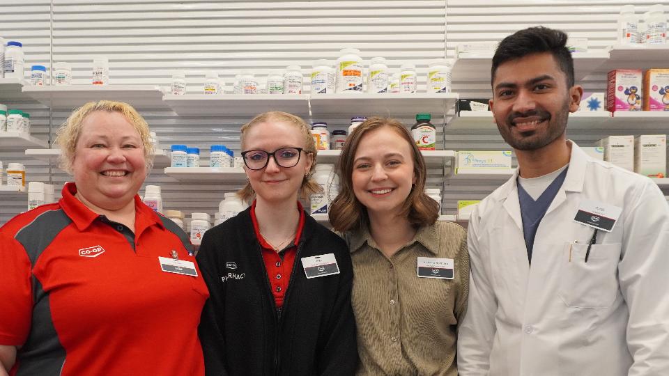 Members of the Pharmacy Team smile at the camera